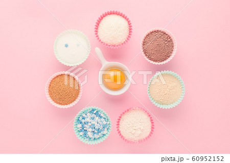 ingredients like a clock, baking time concept, on pink background 60952152