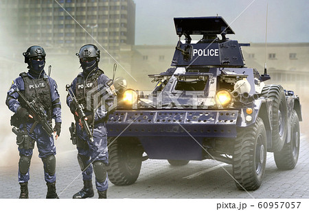 Police special force on standby infront of the armored vehicles during special opps 60957057