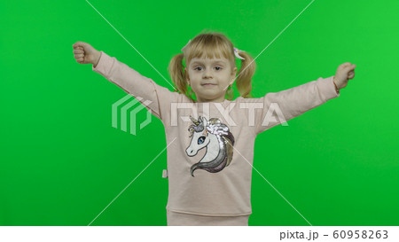 Girl in unicorn sweatshirt. Happy four years old child. Chroma Key 60958263