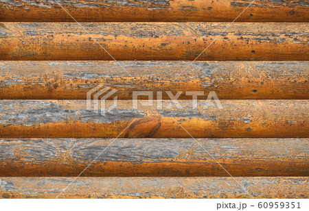 Wooden wall made of painted logs. Natural 60959351