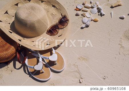 travel suitcase and accessories such as glasses, flip flops, lying on the beach, product photo for travel agencies and resorts, maldives travel suitcase and accessories such as glasses, flip flops, lying on the beach, product photo for travel agencies and resorts, maldives 60965108