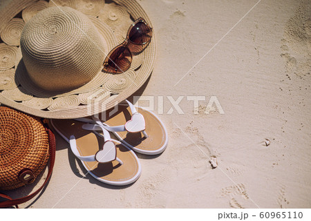 travel suitcase and accessories such as glasses, flip flops, lying on the beach, product photo for travel agencies and resorts, maldives travel suitcase and accessories such as glasses, flip flops, lying on the beach, product photo for travel agencies and resorts, maldives 60965110