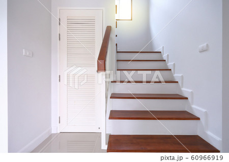 brown wooden stair and white wall in residential house brown wooden stair and white wall in residential house 60966919