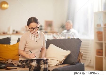 Adult Woman Counting Home Finances Adult Woman Counting Home Finances 60967206