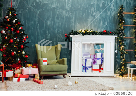 Christmas tree with gifts decor interior new year lights garlands 60969326