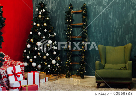 Christmas tree with gifts decor interior new year lights garlands 60969338