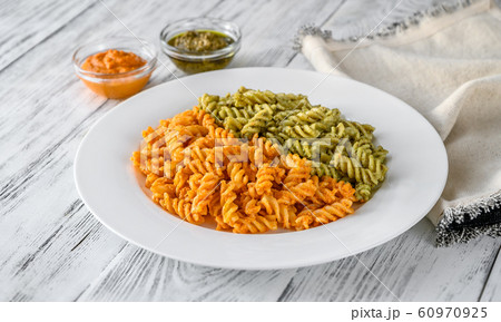 Fusilli with traditional and tomato pesto 60970925