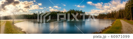 Panorama view at Wundschuher See in Wundschuh, Styria, Austria near Graz. View at forests and lake. 60971099