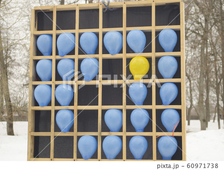 Colored balloons on a wooden bench.  60971738