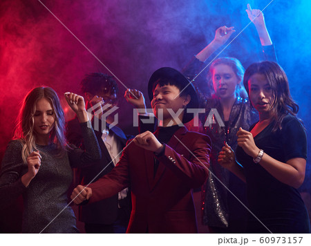 Young People Dancing in Nightclub Young People Dancing in Nightclub 60973157