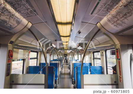 Inside The Wagon Train Germany, Dusseldorf. Empty train interior. interior view of corridor inside passenger trains with blue fabric seats of German railway train system 60973805