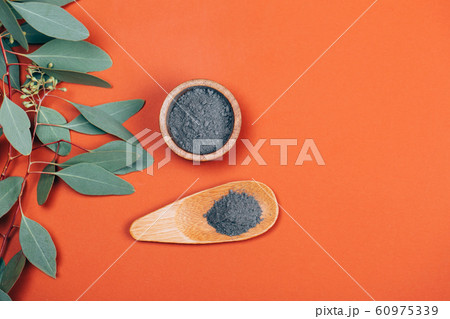 Grey clay with wooden spoon 60975339