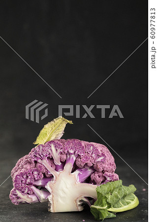 Cross cut of Fresh purple cauliflower on dark Cross cut of Fresh purple cauliflower on dark 60977813