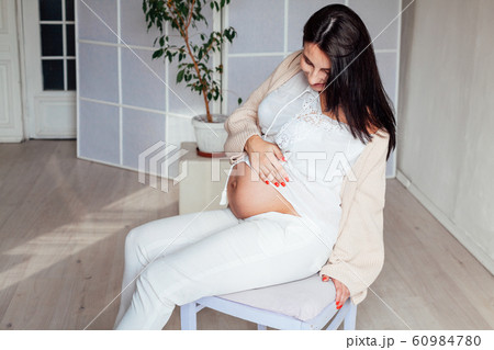 pregnant mom expecting a baby before birth 60984780