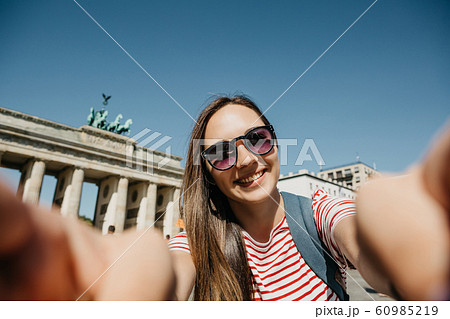 Young beautiful girl makes selfie 60985219