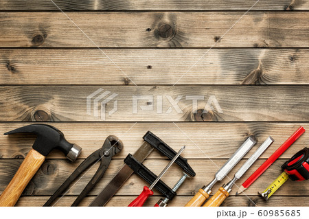 Work tools for carpenter on wooden background. Work tools for carpenter on wooden background. 60985685