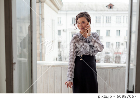 Portrait of a beautiful fashionable Asian woman in a business suit in the office Portrait of a beautiful fashionable Asian woman in a business suit in the office 60987067