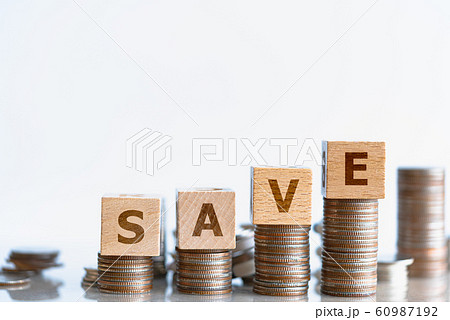 Wood block SAVE and coins stack. 60987192