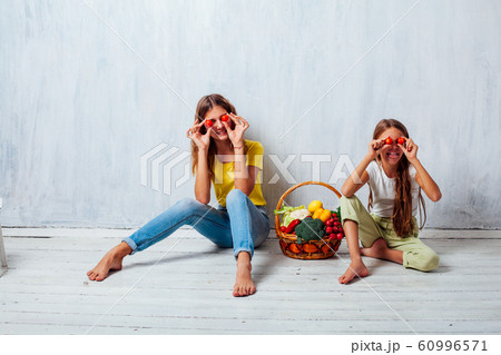 children sit with fresh vegetables healthy eating fruit 60996571