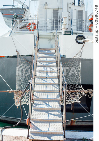 the ladder of the ship anchored to the berth of the port the ladder of the ship anchored to the berth of the port 60996749