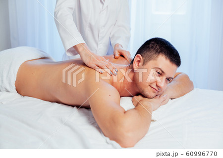 a massage therapist makes therapeutic massage Spa a massage therapist makes therapeutic massage Spa 60996770