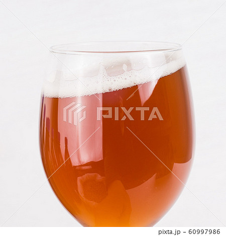 glass of home made craft beer and bag of light 60997986