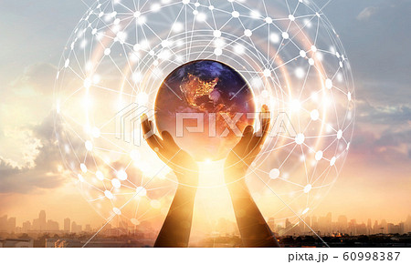 Abstract science. Hands touching earth and circle global network connection, data exchanges worldwide on city sunset background. Innovation. Creative and inspiration. Idea and imagination.  60998387