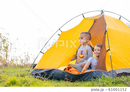 Little boy in a tent. Camping in the nature. Little boy in a tent. Camping in the nature. 61001152