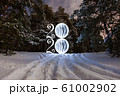 2020 written on the air with glowing ball at the background of winter forest 61002902