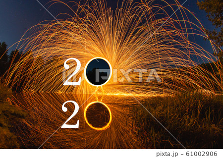 2020 written on the air with flying burning sparks 61002906