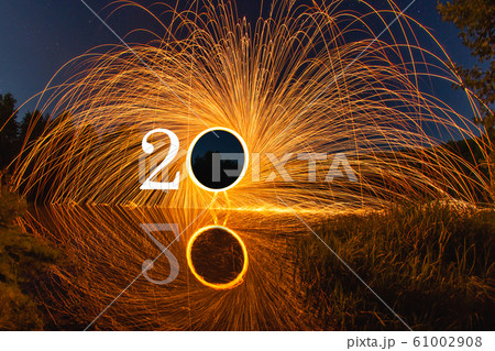 2020 written on the air with flying burning sparks 61002908