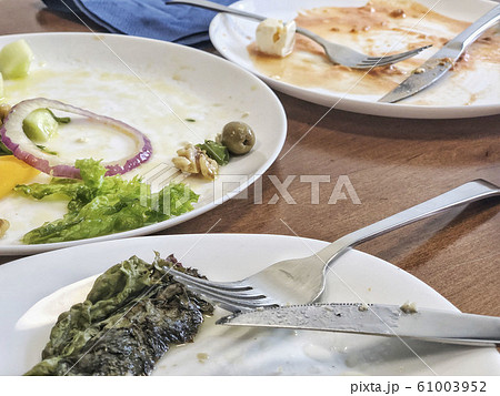 leftovers of a salad on table 61003952