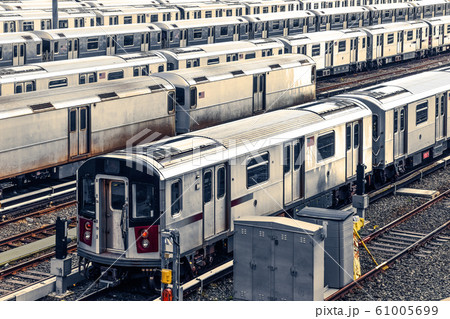 Row of trains in the Maintenance Shop at sunset. 61005699
