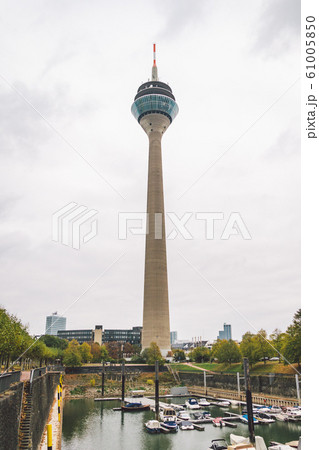 25 October 2018 Germany, Dusseldorf. TV tower, sightseeing in the city center in the fall in cloudy weather. Rhine Tower Rheinturm in Dusseldorf. It is the tallest building 25 October 2018 Germany, Dusseldorf. TV tower, sightseeing in the city center in the fall in cloudy weather. Rhine Tower Rheinturm in Dusseldorf. It is the tallest building 61005850