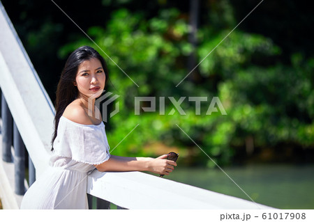 Close-Up Portrait Of Beautiful Asian Girl at sunny Close-Up Portrait Of Beautiful Asian Girl at sunny 61017908