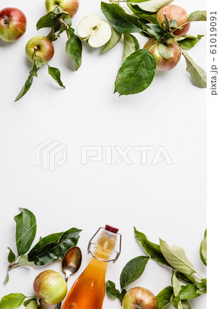 Apple cider vinegar and fresh apples, flat lay, space for your text 61019091