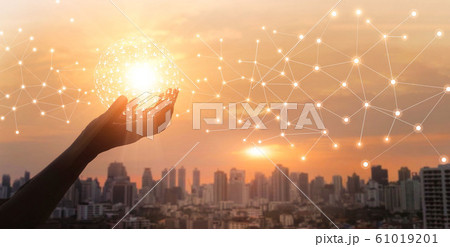 Businessman holding global network and data customer connection on big city background 61019201