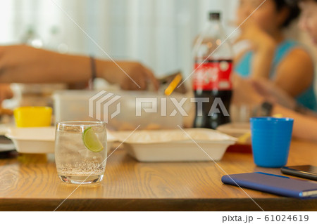Healthy nutrition of drinking water with slice lime on lunch table. 61024619