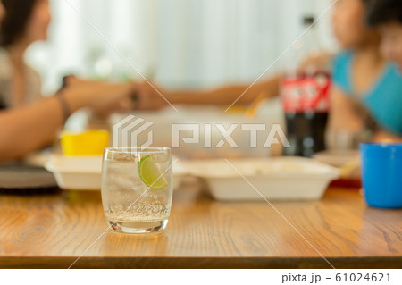 Healthy nutrition of drinking water with slice lime on lunch table. 61024621
