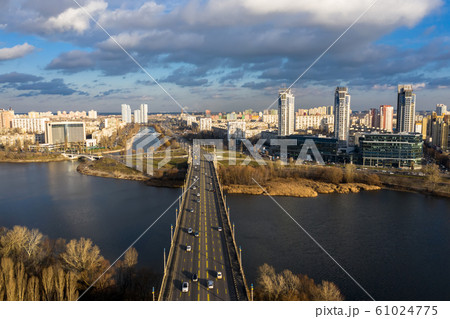 City Traffic on the Patona Bridge. View of Rusanovskaya Embankment. 61024775