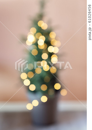 Defocused background Living room with christmas tree. Pink toned 61026456