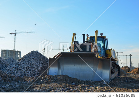 Bulldozer during of large construction jobs at building site. Bulldozer during of large construction jobs at building site. 61026689