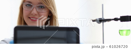 A female doctor in a chemical laboratory holds A female doctor in a chemical laboratory holds 61026720
