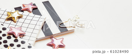 Desktop feminine composition. Notepads and stars Desktop feminine composition. Notepads and stars 61028490