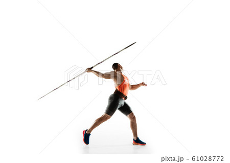 Male athlete practicing in throwing javelin isolated on white studio background 61028772