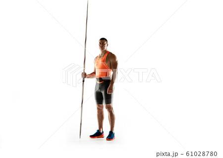 Male athlete practicing in throwing javelin isolated on white studio background 61028780