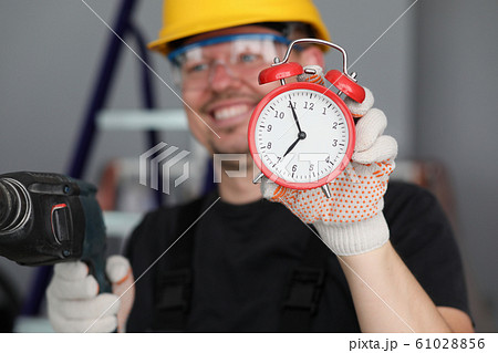 Happy enthusiastic construction worker 61028856