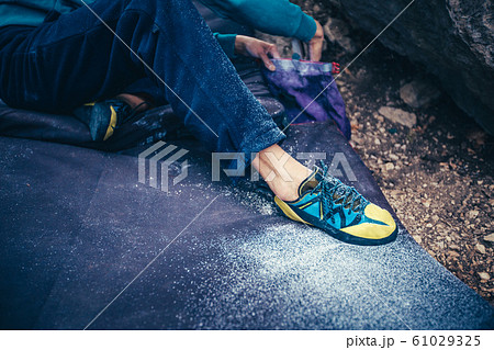 Leg in climbing shoe photo. 61029325