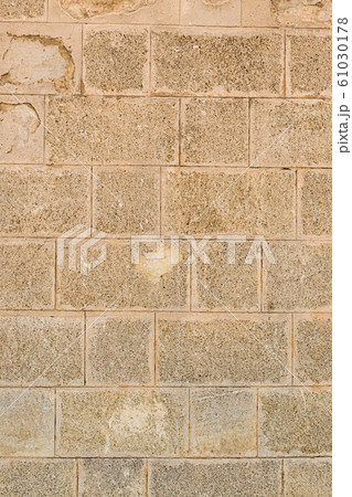 stone wall with light beige blocks. vertical stone wall with light beige blocks. vertical 61030178