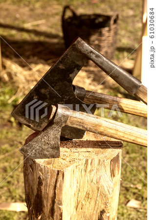 iron ax stuck into a log old traditional weathered iron ax stuck into a log old traditional weathered 61030684